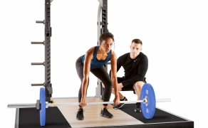 Nautilus---Barbell-Deadlift---Trainer-with-Client
